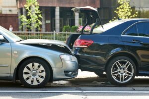 Automobiles damaged in a street car crash accident.