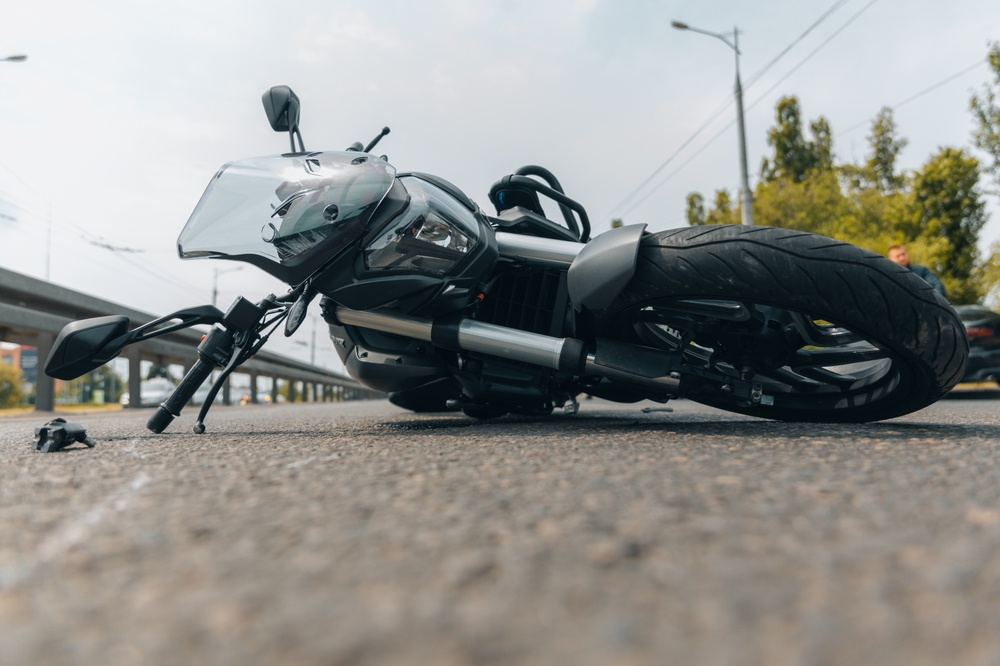 The Motorcycle Lies On The Sidewalk After A Ride.
