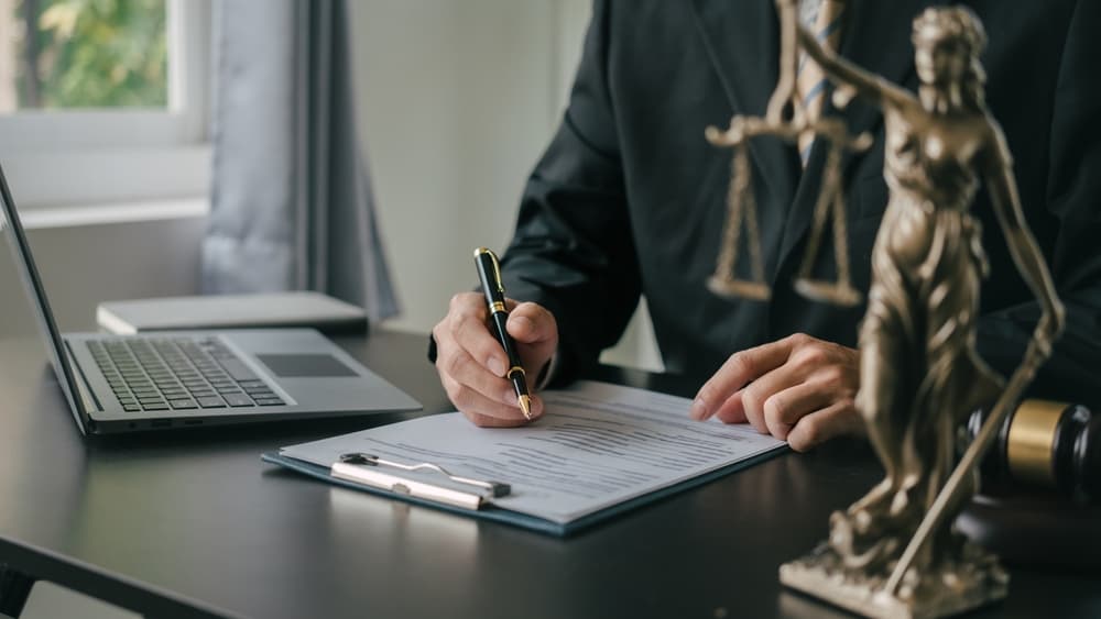 Personal injury lawyer reviewing documentation to build a timeline and strengthen a claim for delayed injuries after a car accident
