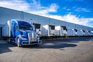 Blue truck standing in parking lot